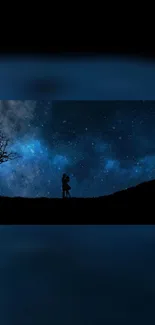 Silhouette of a couple under a starry night sky with a cosmic backdrop.