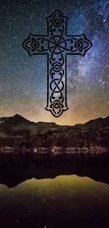 Intricate cross with starry night sky and mountain reflection.