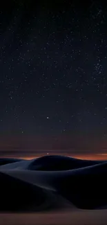 Starry night over desert dunes wallpaper.