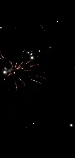 Starry night with fireworks display in a dark sky.