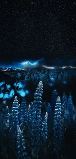 Blue night scene with glowing flowers and starry sky in a mountain landscape.