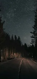 Serene forest road under a starry night sky mobile wallpaper.