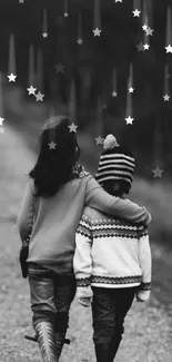 A monochrome image of two children walking under a starry sky.