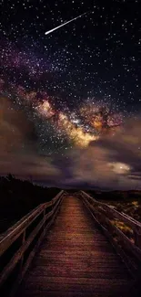 Wooden path under a starry galaxy-filled night sky.