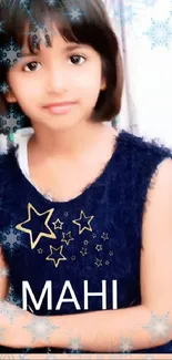 Girl in blue dress with stars and snowflakes.