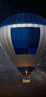 Hot air balloon under a starry night sky.