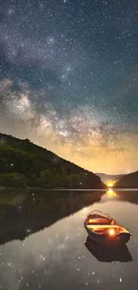 Starry night with boat reflection on a calm lake under the milky way.