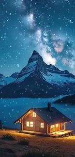 Cozy cabin under starry night sky with snowy mountain backdrop, ideal for phone wallpaper.