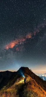 Starry night sky over mountain path illuminated by the Milky Way.