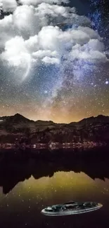 Starry night sky over a mountain reflected in a lake with dreamy clouds.