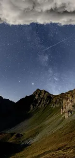 Starry night sky over a mountain landscape with soft clouds.