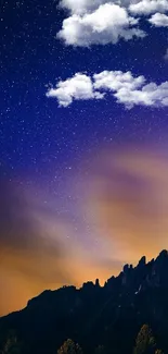 Starry night sky and mountain landscape wallpaper.