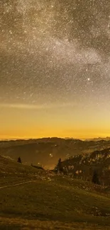 Star-filled night sky over calm mountains with golden hue.