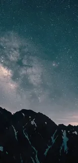 Starry night sky over mountains with galaxy view.