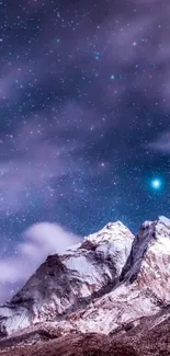 Starry night sky over snowy mountain peaks wallpaper.