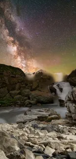 Starry night over mountains with waterfall, showcasing the Milky Way.