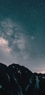 Starry night sky over dark mountain silhouettes.