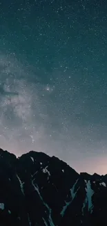 Starry night sky above mountains in stunning view.