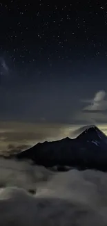 Majestic mountain under a starry night sky with clouds and celestial beauty.