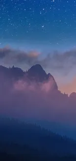 Starry night sky over misty mountain range with twilight hues.