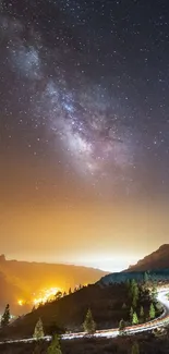 Night sky over mountains with Milky Way stars shining.