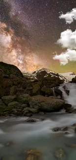 A stunning view of a starry sky over a mountain waterfall at night.