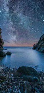 Scenic view of starry night over a calm ocean with rocky shores.