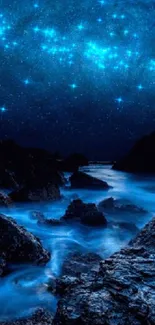 Starry night ocean with bright stars over a tranquil shoreline.