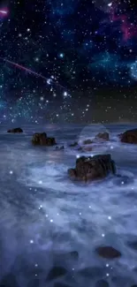 Starry night ocean scene with rocks and cosmic sky.