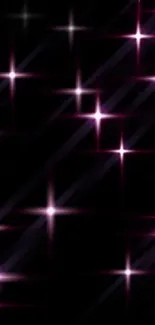 Starry night mobile wallpaper with pink and purple stars on black background.