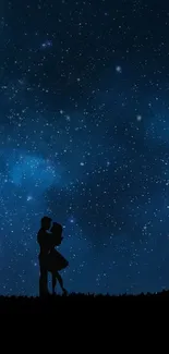 Couple silhouette under a starry blue night sky wallpaper.