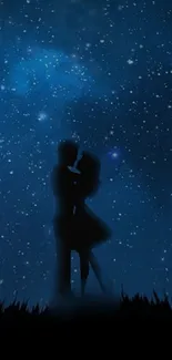 Silhouette of a couple under a starry night sky.