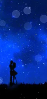 Romantic couple silhouette under a starry deep blue sky.