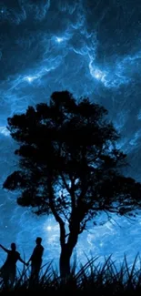 Silhouetted tree and figures under a starry blue night sky.