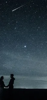 Silhouette of couple under a starry night sky, capturing serene beauty.