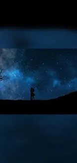 Silhouette of couple under a starry night sky wallpaper.