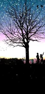 Silhouette of a tree and figures against a starry purple sky wallpaper.