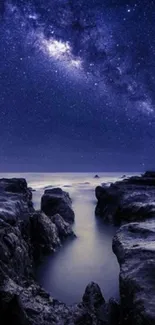 Starry night sky over rugged cliffs in a tranquil nature setting.