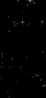 Starry night wallpaper with twinkling stars on a black background.