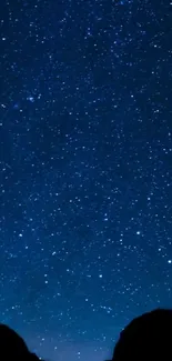 A starry night sky wallpaper with countless twinkling stars on a deep blue background.