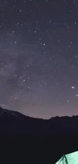 A serene starry night sky with a tent in the foreground.