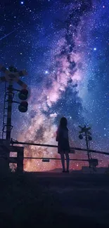 Girl stands beneath a vibrant, star-filled night sky with a stunning Milky Way view.