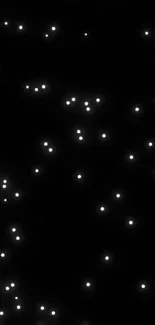 Starry night wallpaper with glowing white dots on a black background.