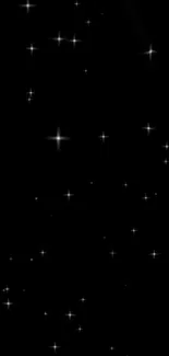 Starry night sky wallpaper with a black background and white stars.