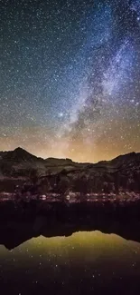 A starry night sky over a mountain reflection in serene waters.