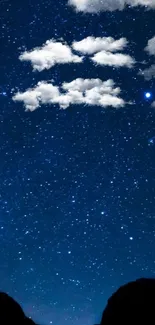 Starry night sky with clouds and dark blue hues in the mobile wallpaper.