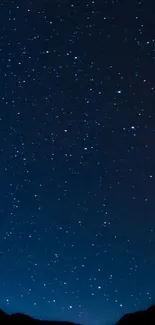 Starry night sky wallpaper for mobile phones with dark blue and countless stars.