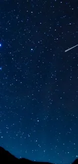 Starry night sky wallpaper with shooting star.