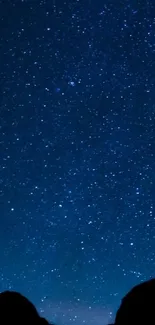 Mobile wallpaper of a star-filled night sky in deep blue hues.