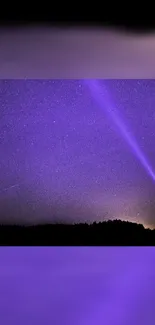 Starry night with purple sky and silhouetted figure holding a light beam.